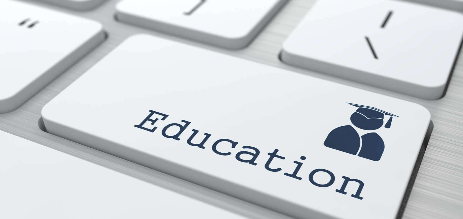 Graphics showing the process of education essay writing on a computer keyboard
